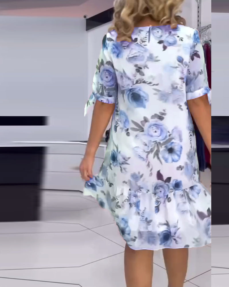 Blommig elegant klänning med rund hals