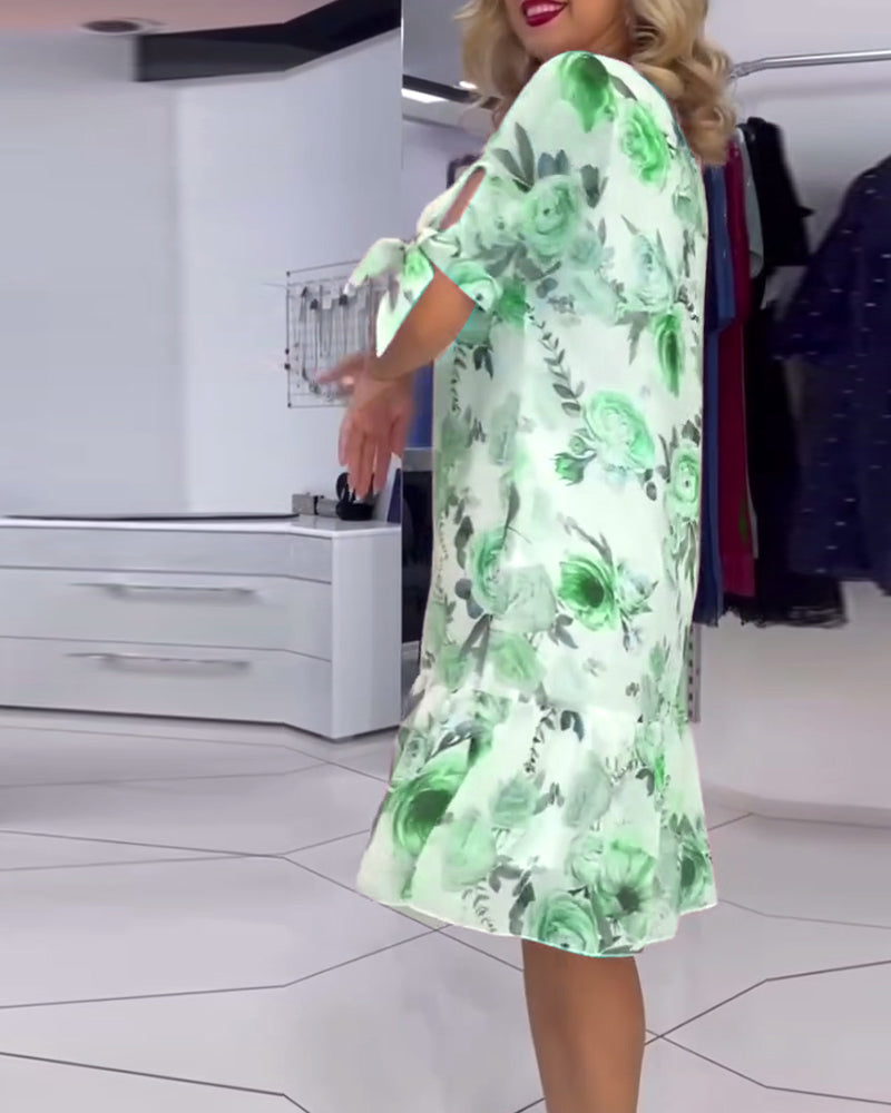 Blommig elegant klänning med rund hals